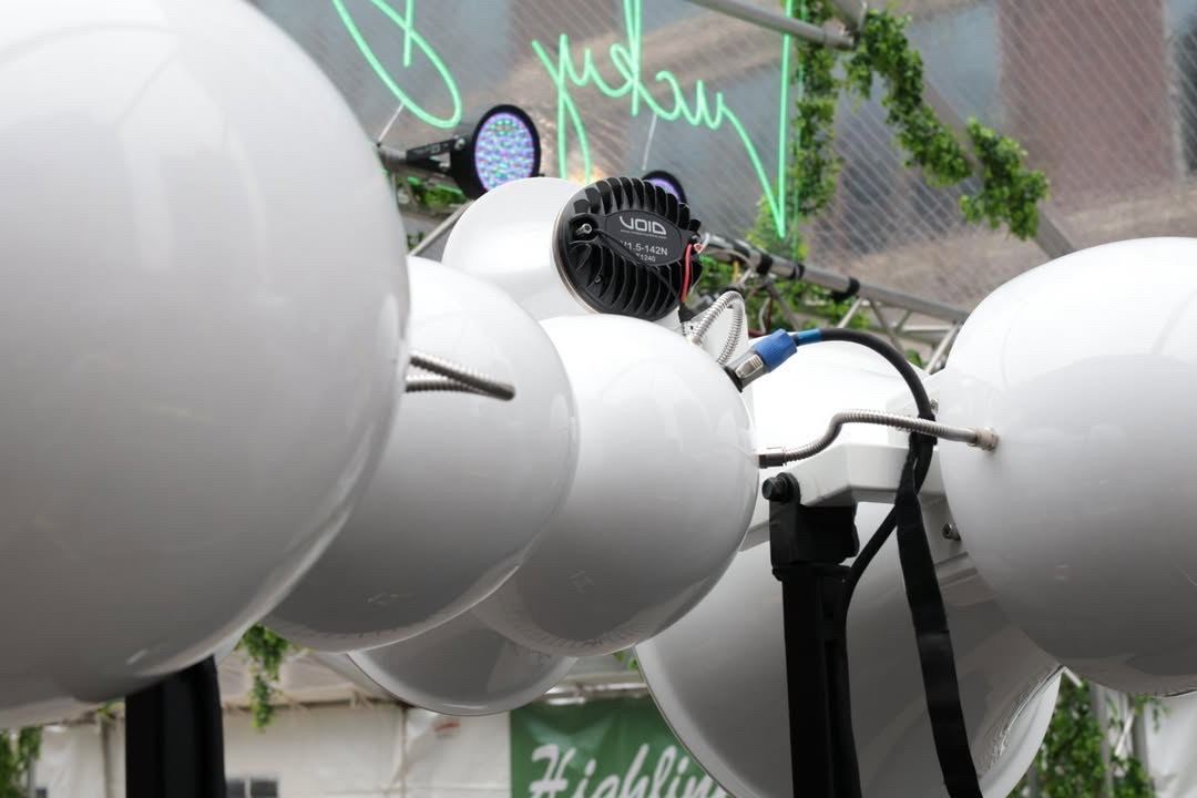 Close-up of a Void compression driver mounted on the back of a white Air Motion horn